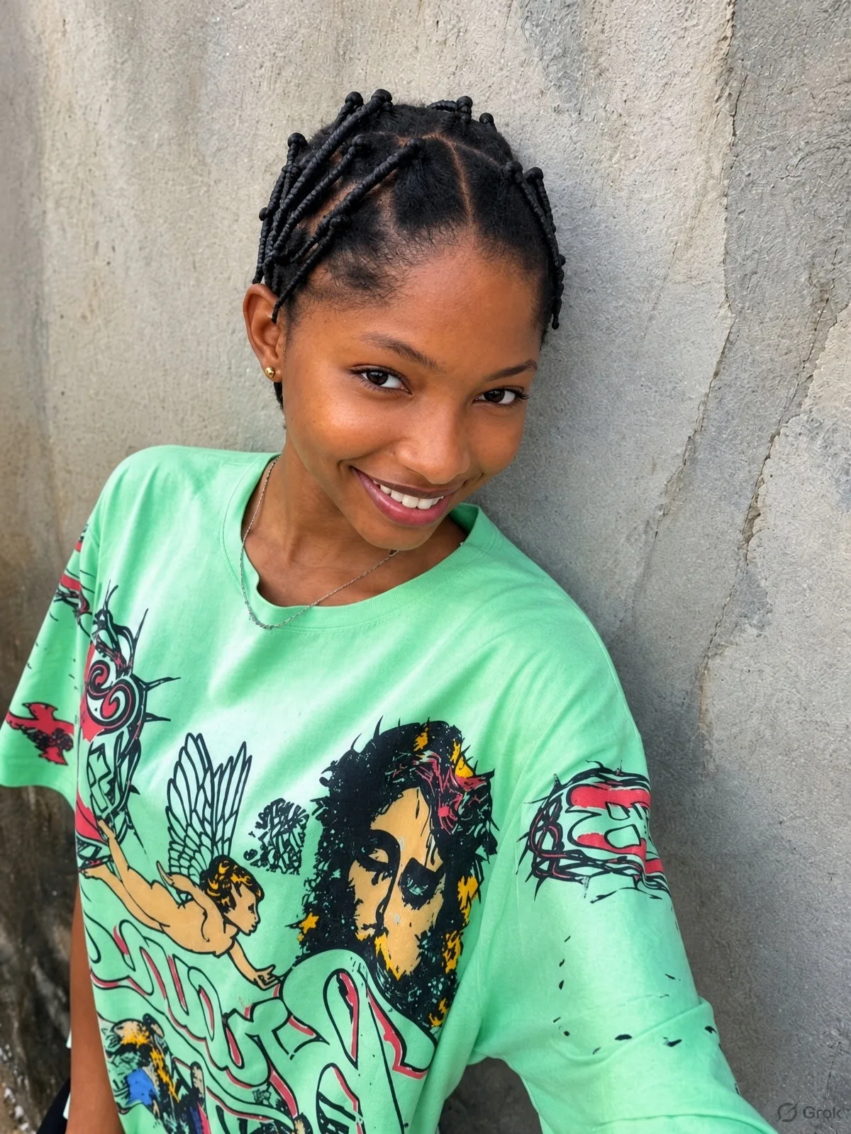 Soma smiling in a mint green tee